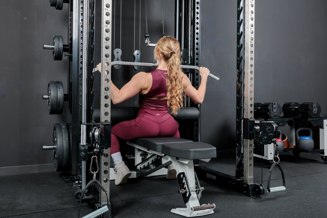 Athlete does a lat pulldown on the Altitude™ rack from REP.