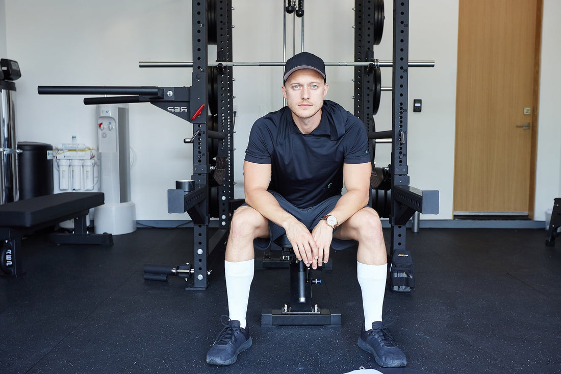 Man sitting on a weight bench