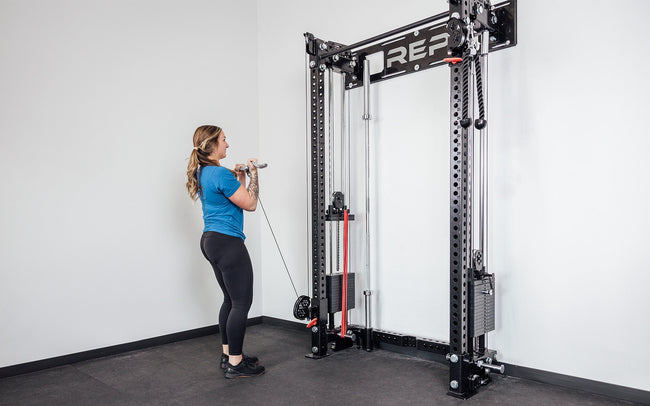 Wall-Mounted Athena being used for a Cable Bicep Curl